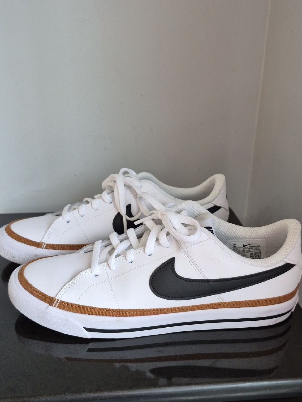 Nike Boy's Size 5Y White Sneakers with Black Swoosh and Brown Accent